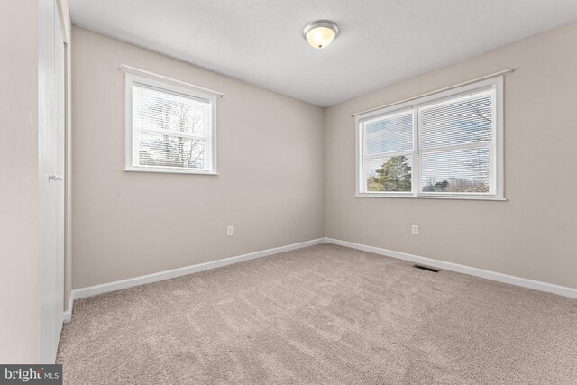 view of carpeted spare room