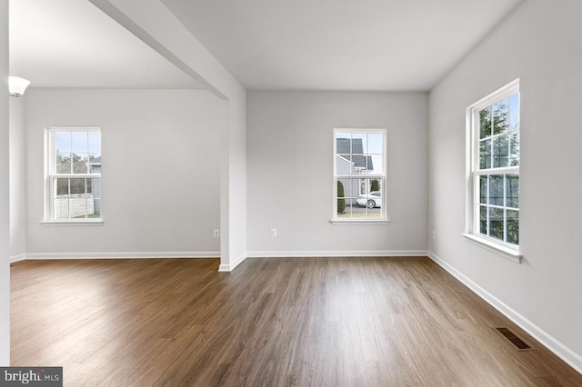 unfurnished room featuring hardwood / wood-style flooring