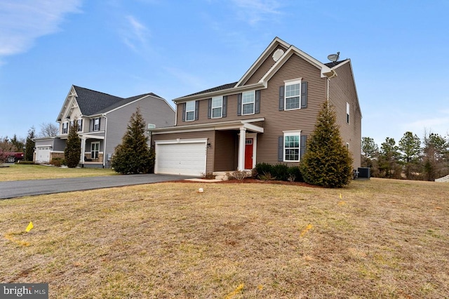 view of front of home with a garage, central AC unit, and a front lawn