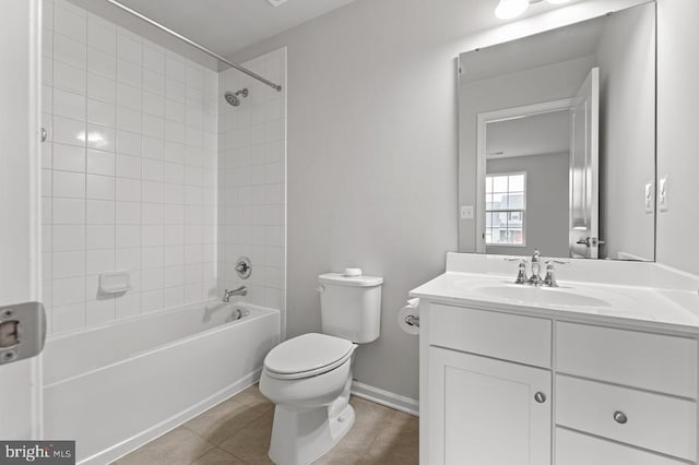 full bathroom with vanity, toilet, tile patterned floors, and tiled shower / bath