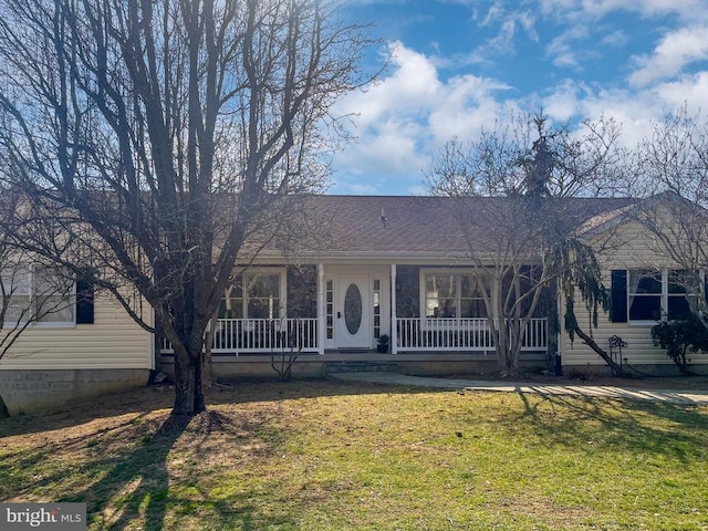 single story home with a front lawn, covered porch, and roof with shingles