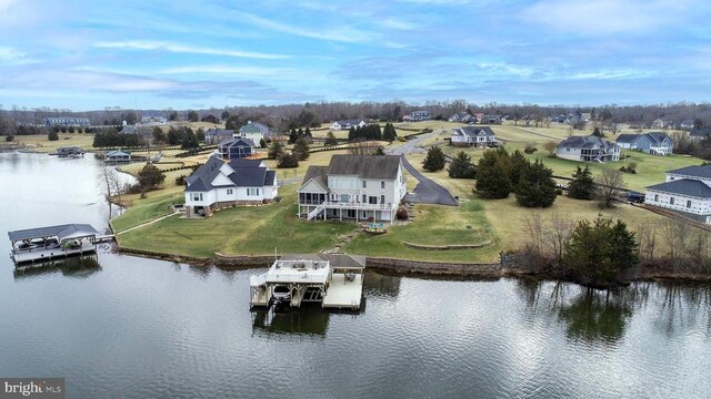 view of yard with a water view, a patio, and a fire pit