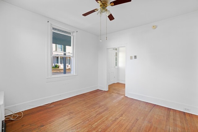 spare room featuring ceiling fan and light wood-type flooring