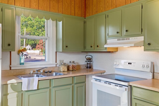 kitchen with tasteful backsplash, sink, and electric range