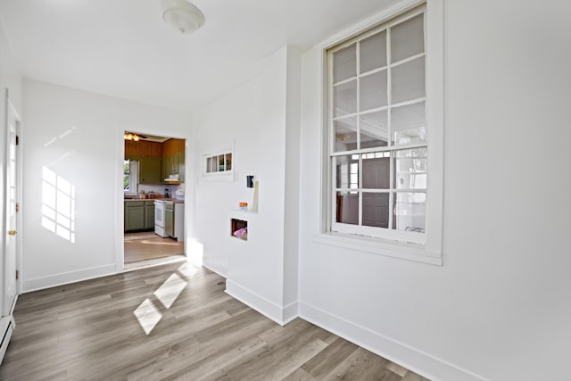 interior space with a baseboard radiator and light wood-type flooring