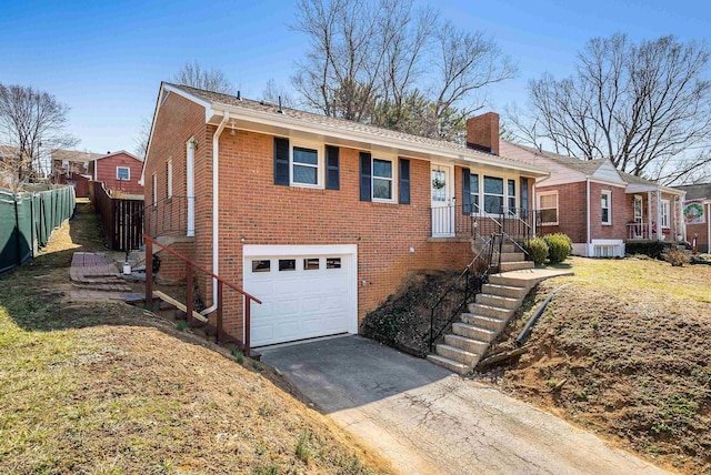 single story home featuring aphalt driveway, fence, an attached garage, brick siding, and a chimney