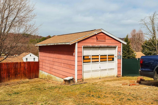 detached garage with fence