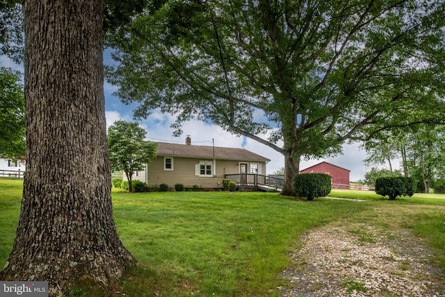 view of yard with a wooden deck