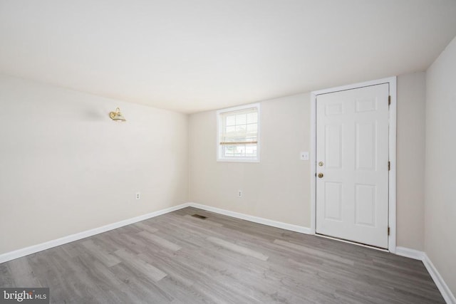 empty room with hardwood / wood-style floors