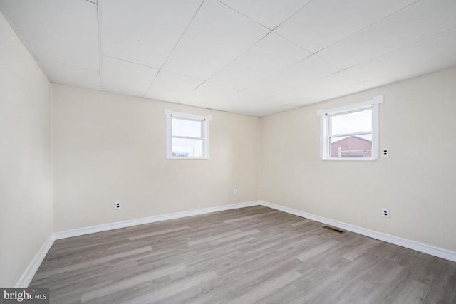 basement featuring light hardwood / wood-style floors