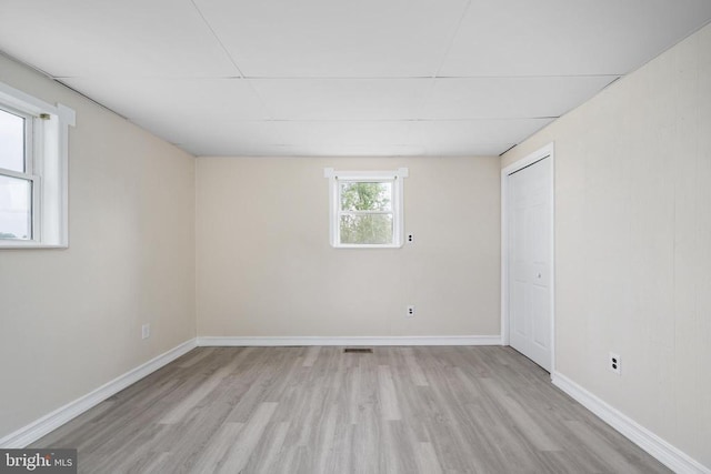 unfurnished room featuring light wood-type flooring