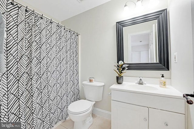 full bathroom with toilet, tile patterned floors, and vanity