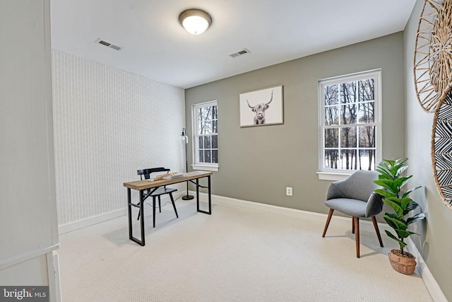 office space featuring light colored carpet, visible vents, baseboards, and wallpapered walls