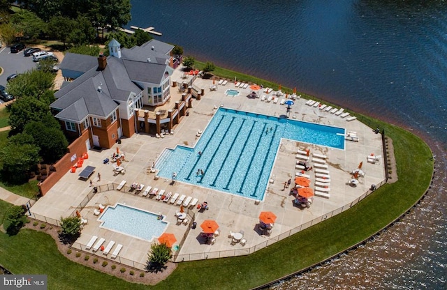 view of pool with a water view