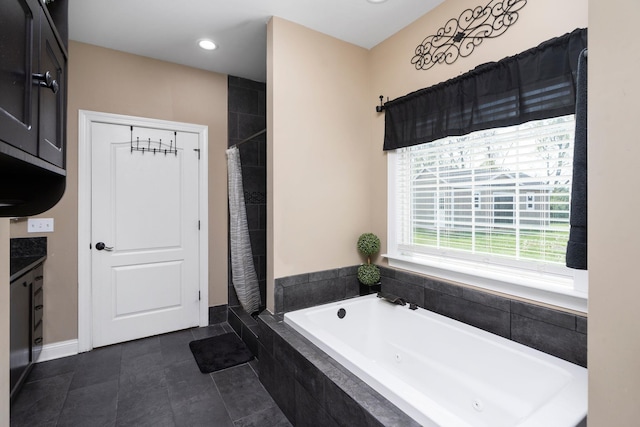 full bath with recessed lighting, vanity, a tub with jets, and tiled shower