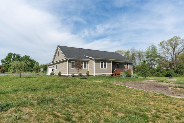 ranch-style house with a wooden deck and a front yard