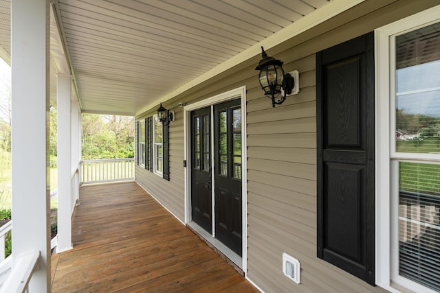 wooden terrace with a porch