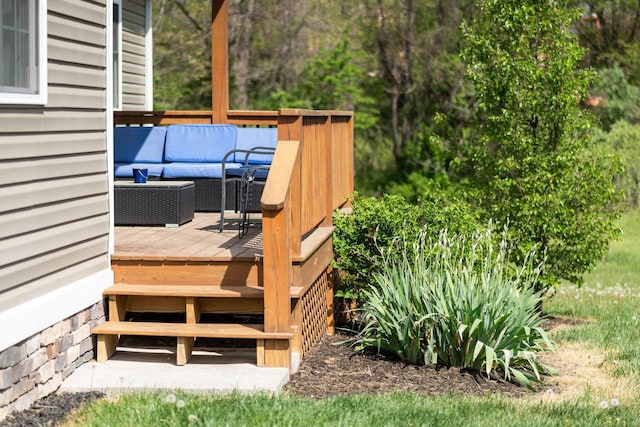 wooden terrace featuring outdoor lounge area