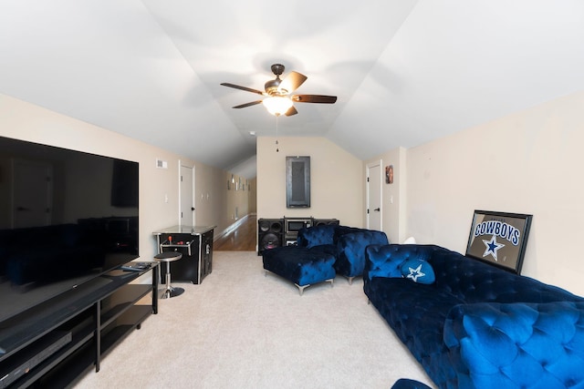 carpeted living area featuring a ceiling fan and vaulted ceiling