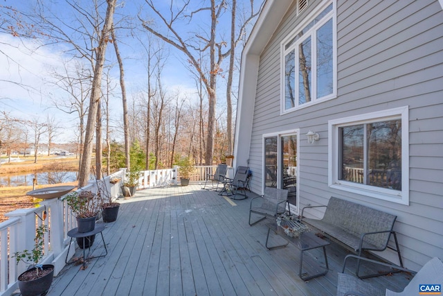 wooden deck with a water view