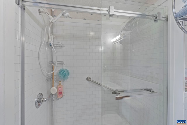 bathroom with a shower stall