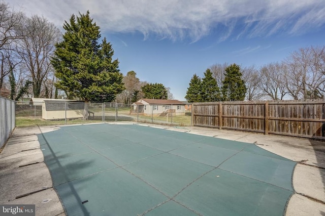 view of pool with fence