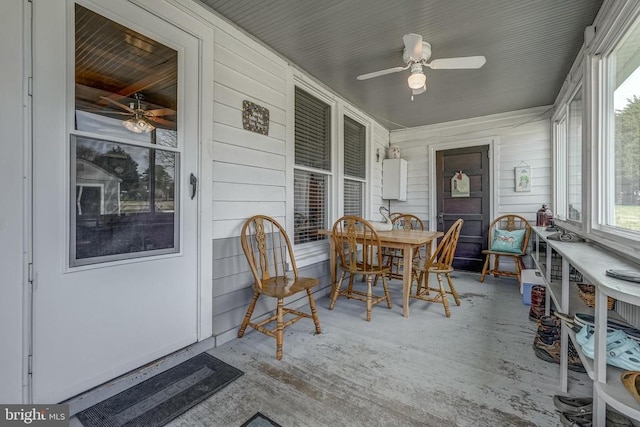 sunroom featuring a ceiling fan