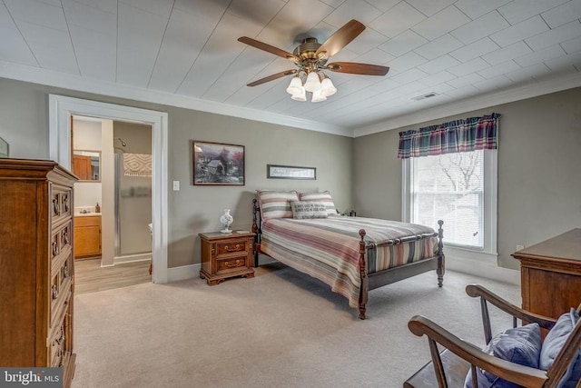 bedroom with visible vents, light carpet, baseboards, and crown molding