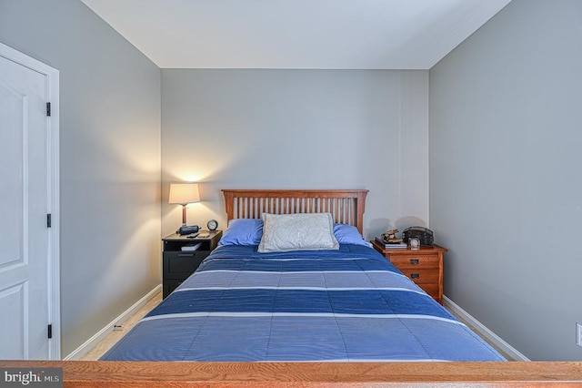 bedroom featuring baseboards