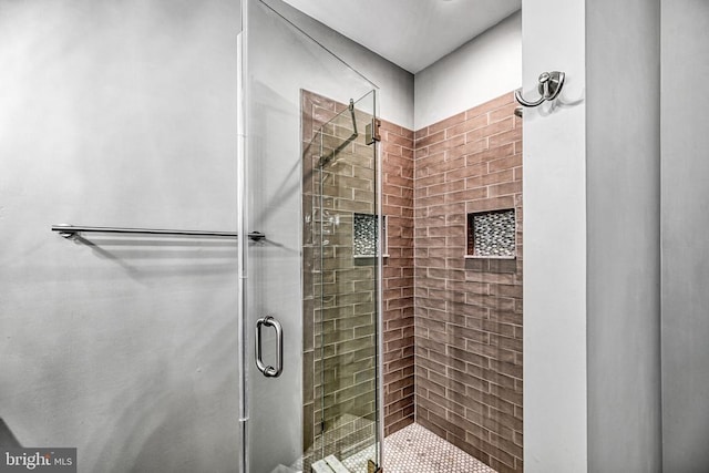 bathroom featuring a shower stall