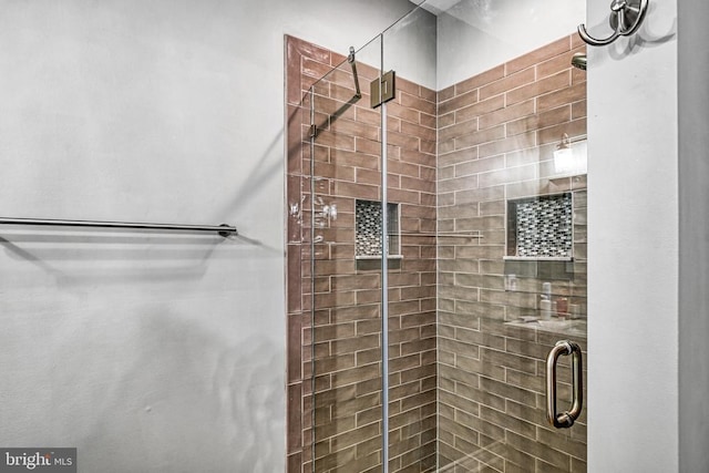 bathroom featuring a shower stall