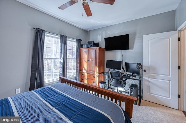 carpeted bedroom with a ceiling fan