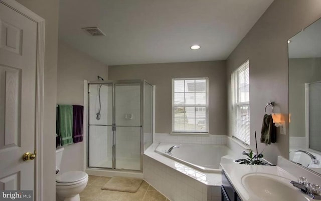 full bath featuring toilet, a stall shower, tile patterned flooring, a bath, and vanity