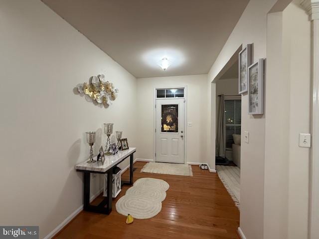 entryway with hardwood / wood-style flooring