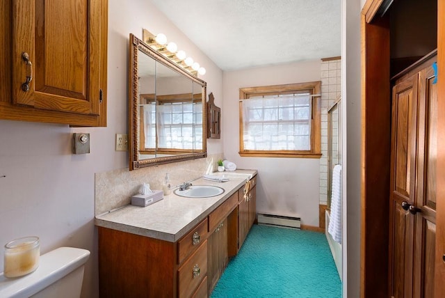 bathroom with toilet, a baseboard radiator, walk in shower, and vanity