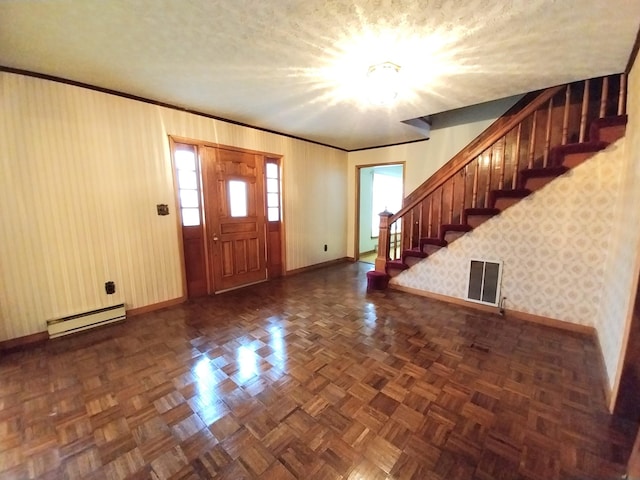 foyer featuring visible vents, stairway, a baseboard heating unit, baseboards, and wallpapered walls