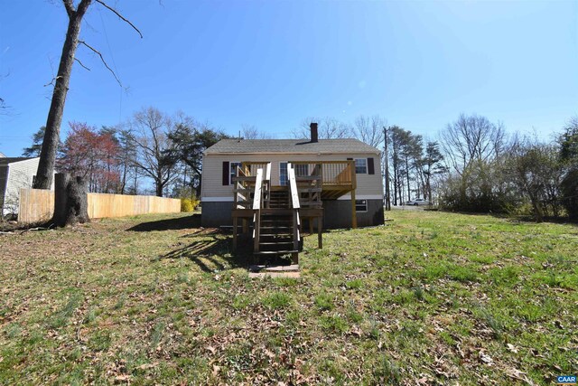 rear view of house featuring a deck