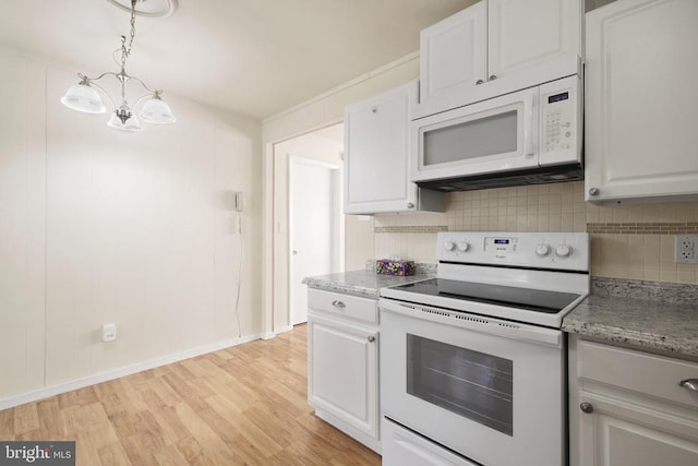 kitchen with tasteful backsplash, pendant lighting, white cabinets, and white appliances