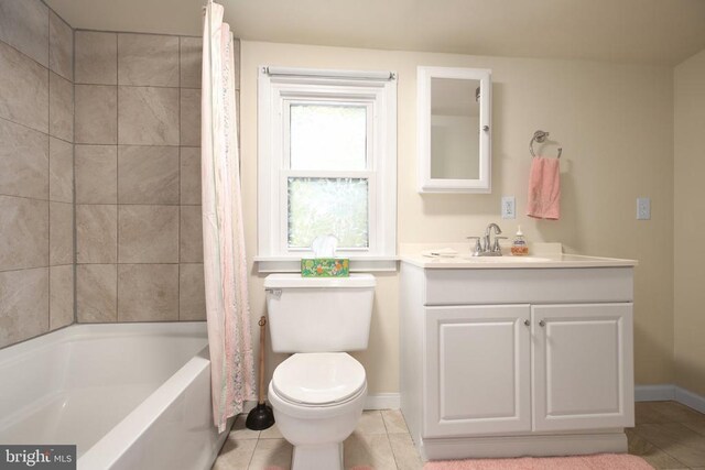 full bathroom with vanity, tile patterned floors, shower / bath combo with shower curtain, and toilet