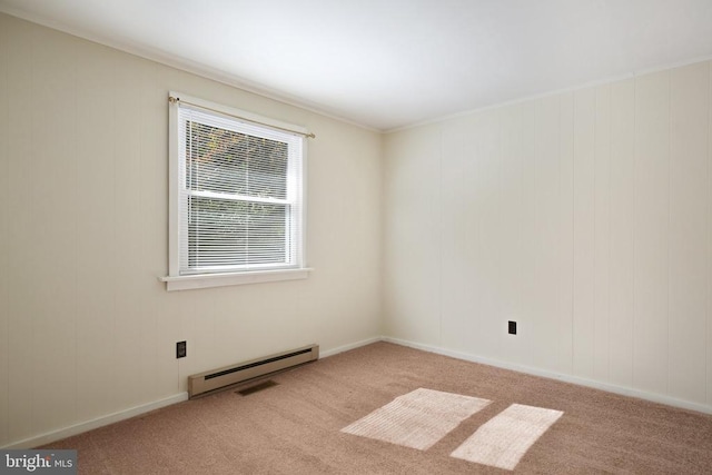 empty room featuring light carpet and a baseboard radiator