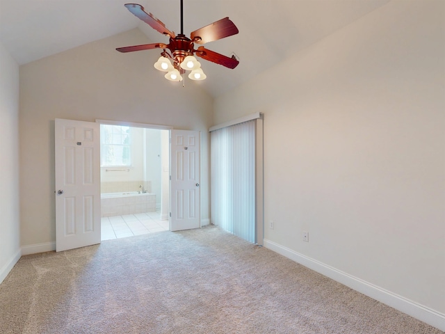 unfurnished bedroom featuring carpet flooring, baseboards, ceiling fan, and connected bathroom