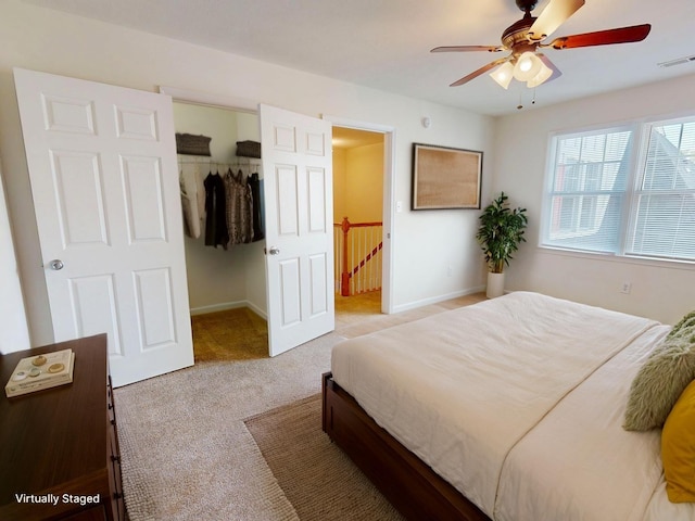 bedroom with visible vents, a ceiling fan, a closet, baseboards, and carpet flooring
