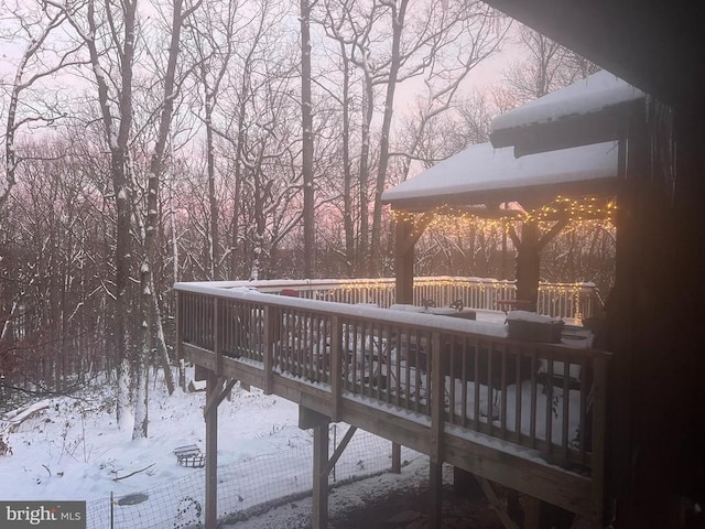 view of snow covered deck