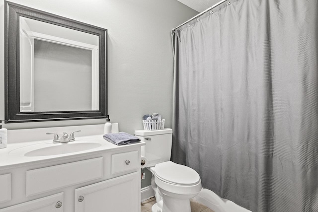 full bath featuring toilet, curtained shower, and vanity