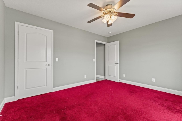 unfurnished bedroom with carpet floors, ceiling fan, and baseboards