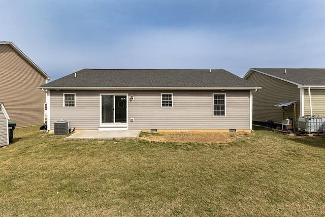 rear view of property featuring a shingled roof, central AC unit, a lawn, a patio, and crawl space