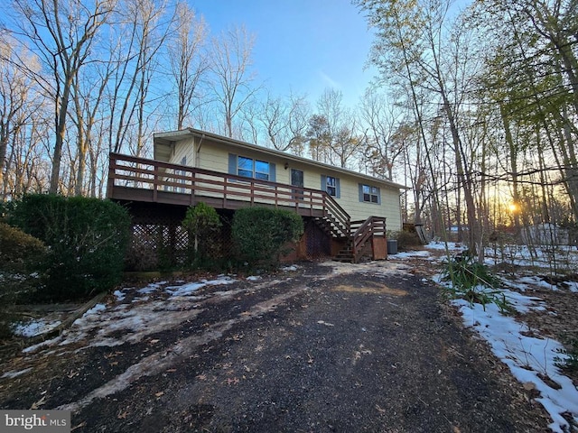 view of front of property with a wooden deck