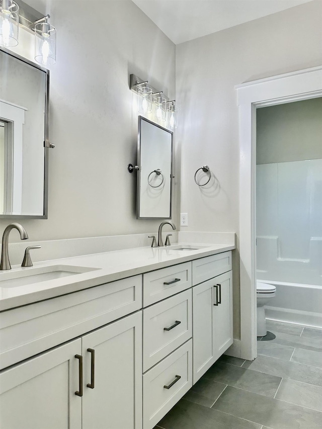 full bathroom with vanity,  shower combination, and toilet