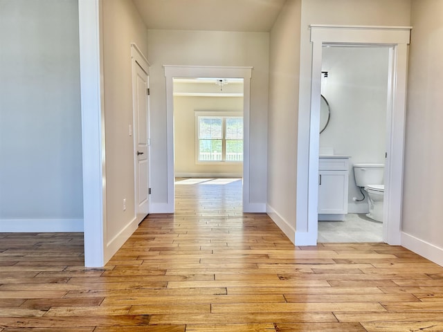 hall with light wood-type flooring