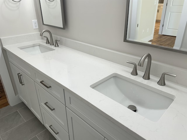 bathroom featuring tile patterned floors and vanity